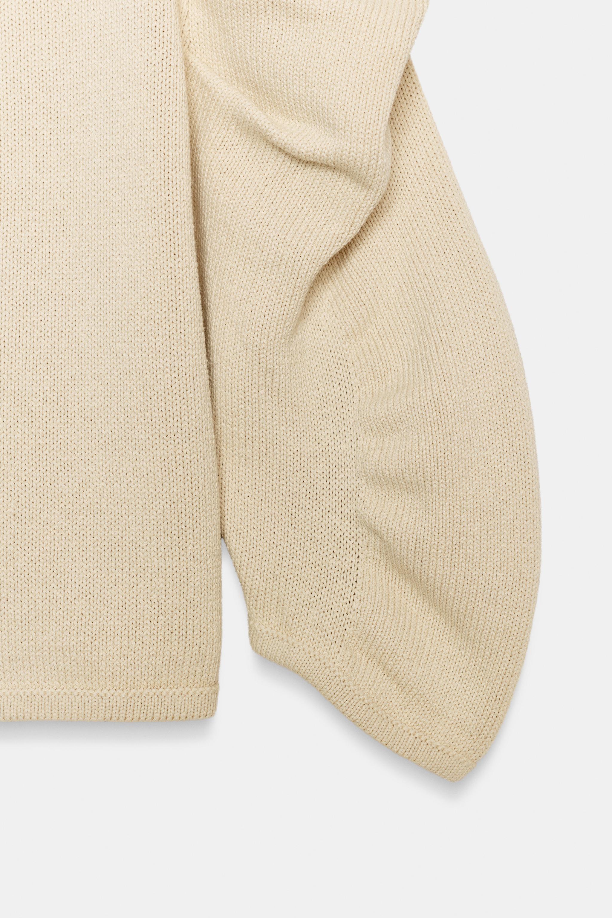 PULL EN MAILLE À MANCHES DRAPÉES
